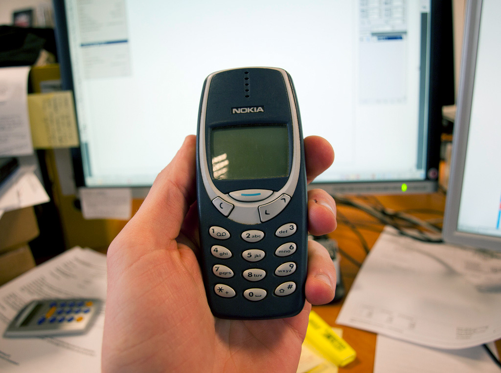 An old Nokia 3310 mobile phone.